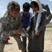 Army Officer Distributes Donated Supplies to Afghan Schoolchildren