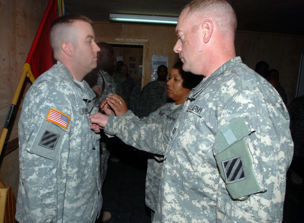 Army Capt. Promotes Soldier to Staff Sergeant in Iraq