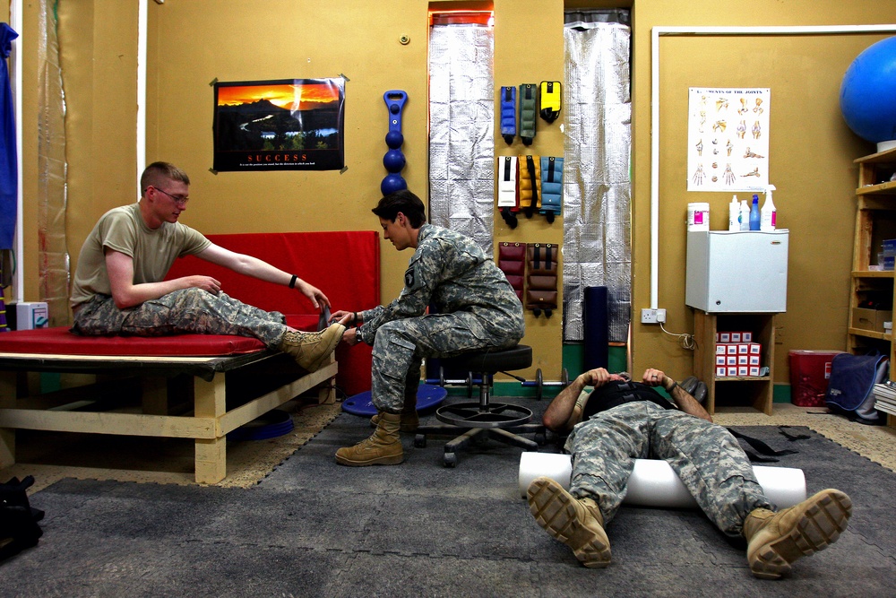 Army Physical Therapist Provides Care to Injured Soldier in Iraq