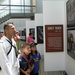 Navy Veteran Brings Children to Military Photo Exhibit