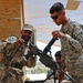 U.S. Soldier Trains Afghan Border Patrol Officer on Weapon Reassembly