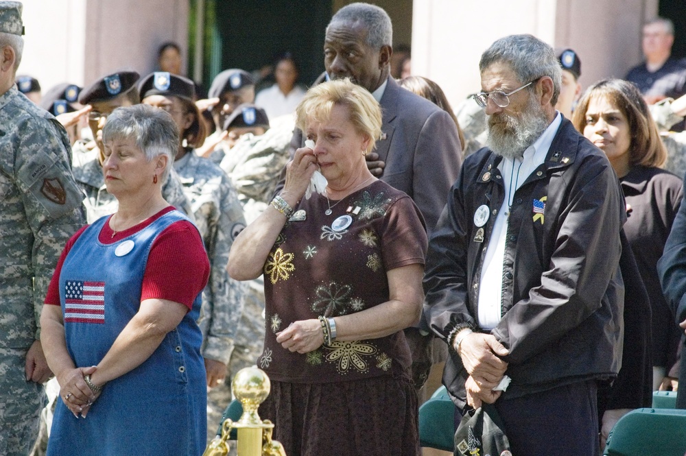 Grieving Parents Mourn Fallen Soldier at Memorial Service