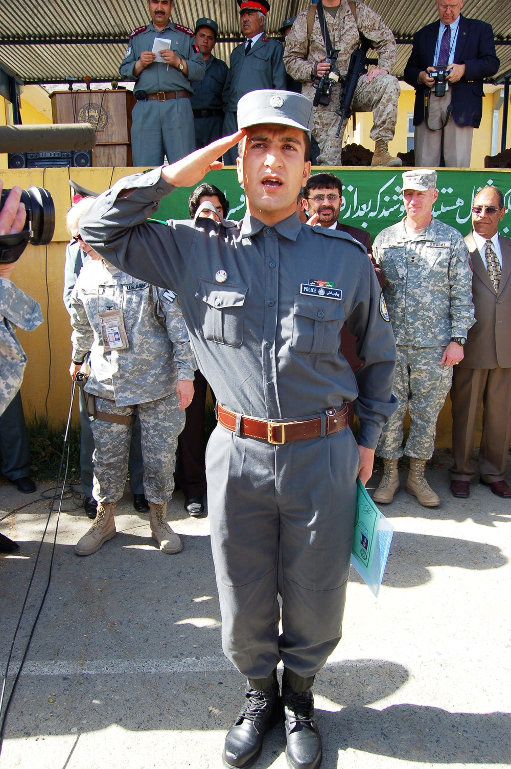 Afghan Police Graduate Salutes Dignitaries at Kabul Ceremony