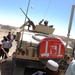 Soldier Distributes Treats to Afghans in Ghazni Province