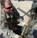 Army Warrant Officer Inspects Apache Helicopter Before Mission in Baghdad