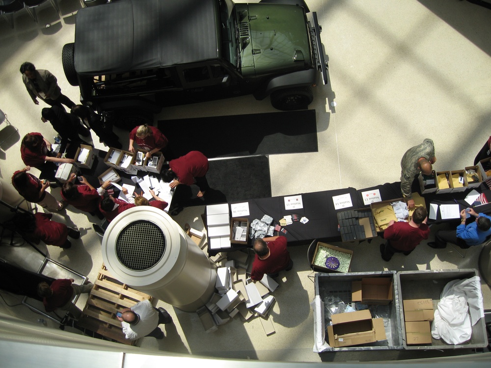 Chrysler Employees Pack Care Packages for Deployed Troops