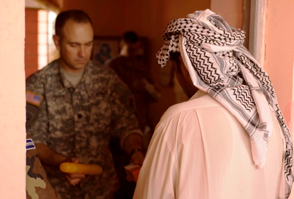 U.S. Army Officer Provides Medical Assistance to Iraqi Villager