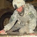 Army Spc. Repairs Roadway Crater in Baghdad