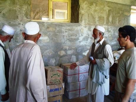 Village Elders Discuss Food Distribution at Medical Engagement in Afghanistan