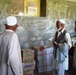 Village Elders Discuss Food Distribution at Medical Engagement in Afghanistan