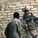 Army Sergeant Engages with Iraqi Citizens During Market Assessment Mission