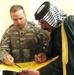 Army Officer Discusses Security with Iraqi Leader Before Providing Water to Village