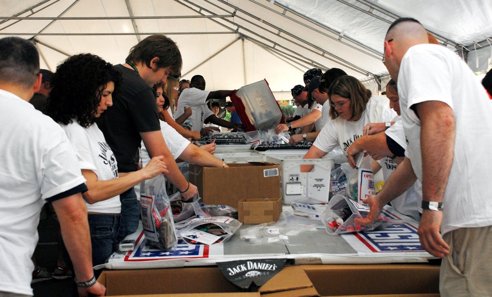 Volunteers Pack Thousands of Care Packages for Troops at USO Event