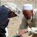 Veterinarian Teaches Goat Herder Deworming Techniques at Farah Fire Base