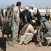 Veterinarian Teaches Goat Herder Deworming Techniques at Farah Fire Base