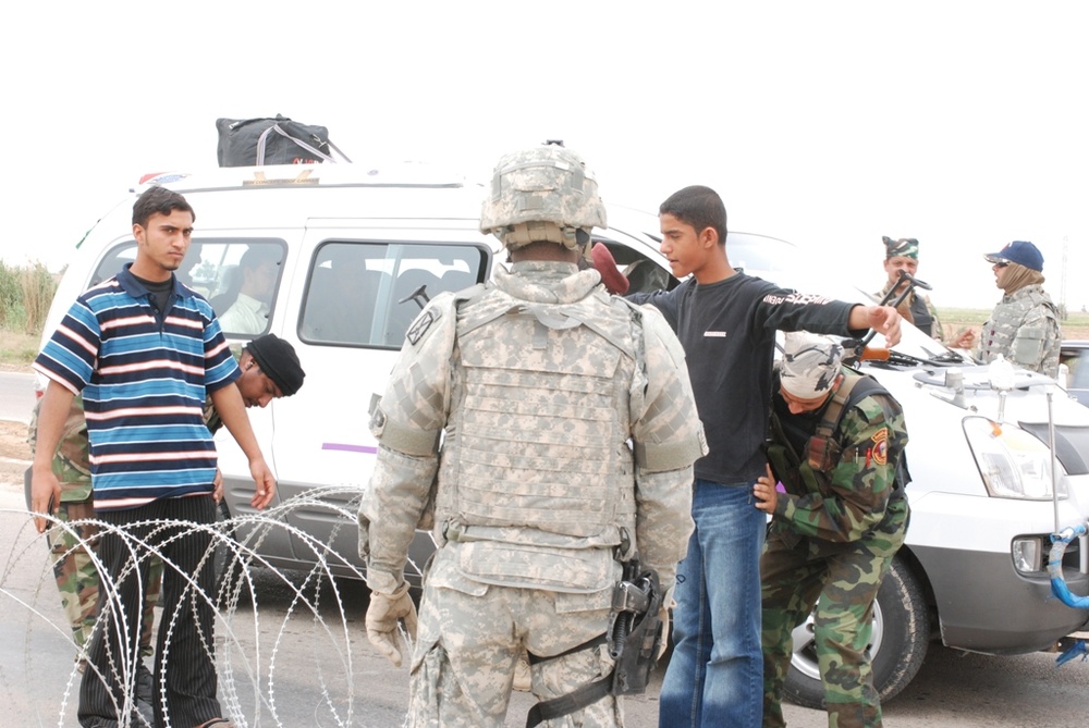 Military Police Assist Iraqi Forces in Checkpoint Operations