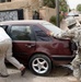Soldiers Assist Iraqi Resident in Baghdad Neighborhood