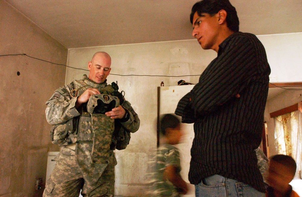 Army Sergeant Registers Iraqi Citizen with Biometric System