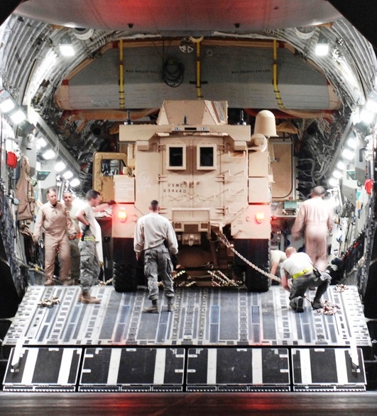 Air Force Airmen Secure MRAP Vehicles for Transport on C-17 Globemaster III