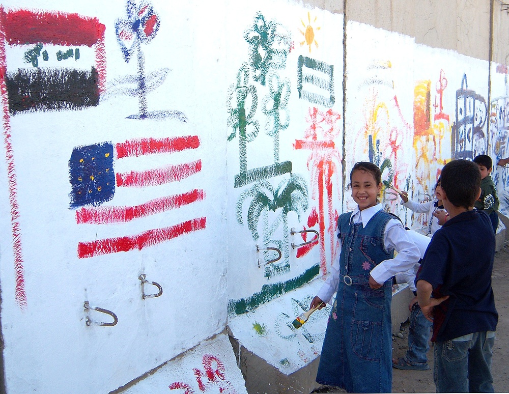 Iraqi Children Celebrate with Art and Flags at Forward Operating Base