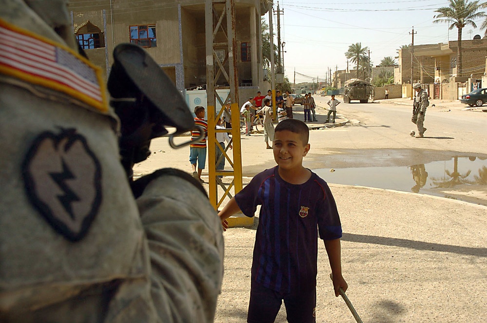 Iraqi Child Speaks with U.S. Soldier in Sadr City, Baghdad