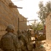 Soldiers Patrol Sadr City Amid Squalid Conditions