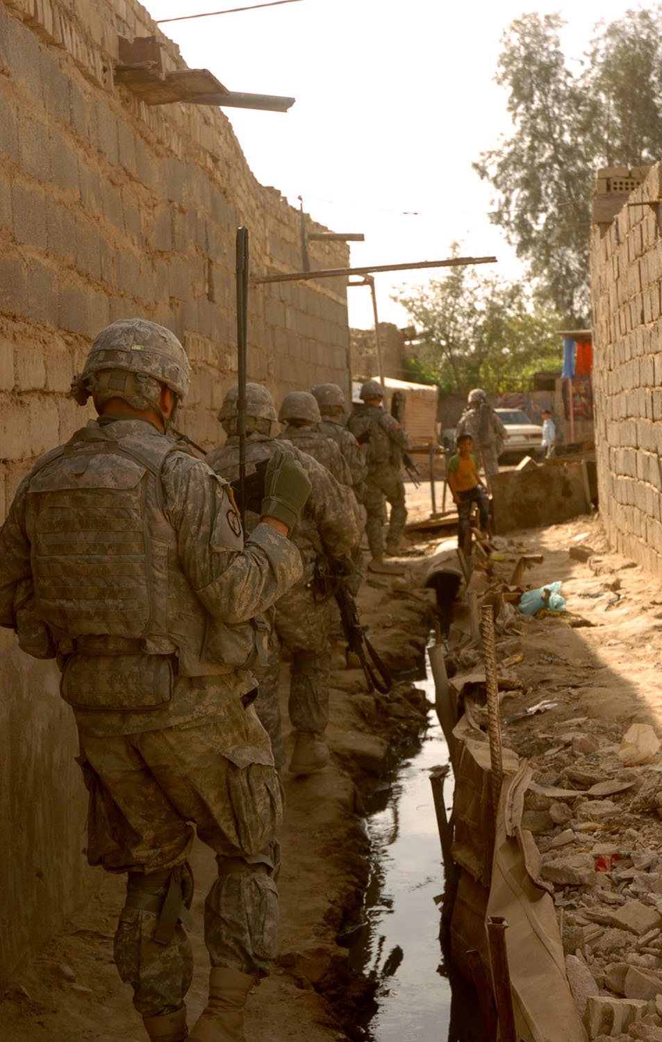 Soldiers Patrol Sadr City Amid Squalid Conditions