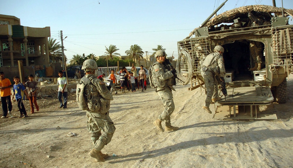 Soldiers Load Back Onto Stryker After Patrol in Sadr City