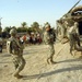 Soldiers Load Back Onto Stryker After Patrol in Sadr City