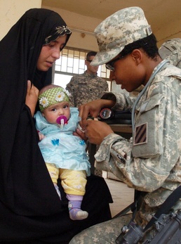 Army Medic Provides Care to Iraqi Infant During Civil Action Program