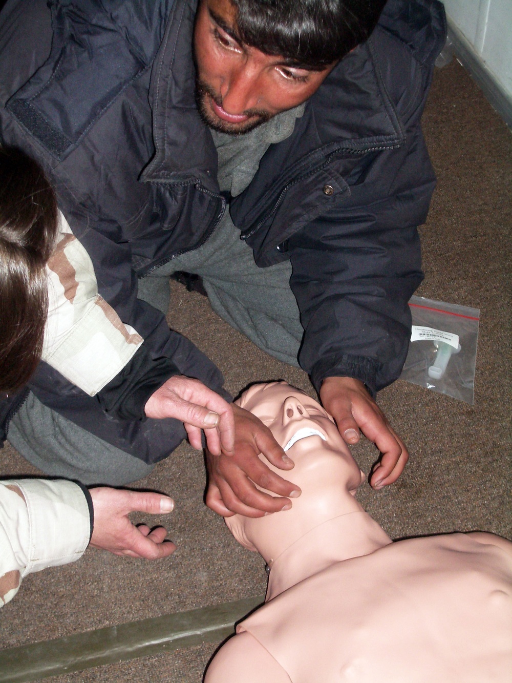 Afghan Police Trainees Learn CPR from U.S. Navy Instructor