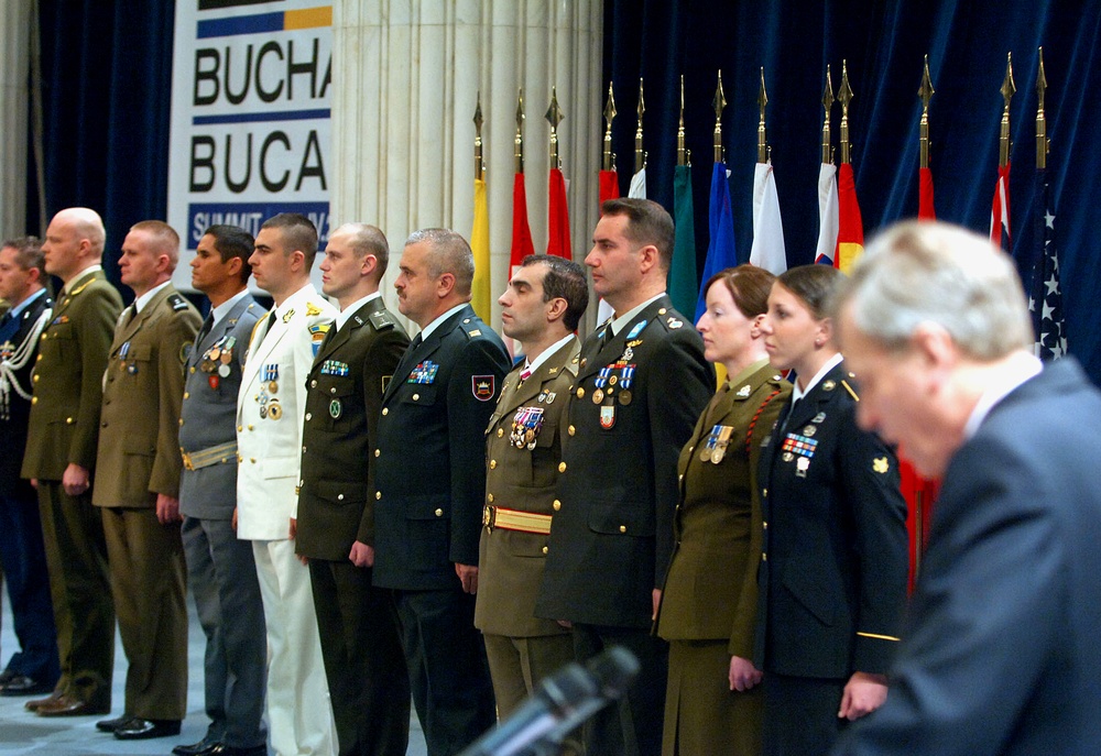 NATO Honors Multinational Troops at Bucharest Summit