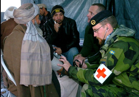 Swedish Army Officer Provides Medical Care to Afghan Elder
