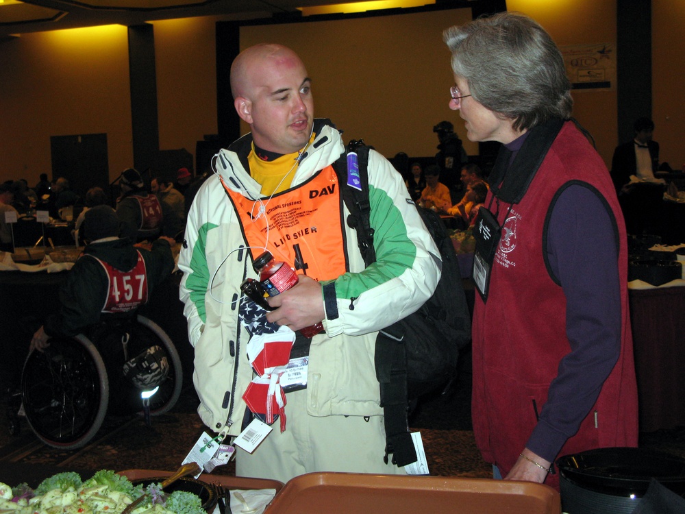 Volunteer Assists Blinded Veteran at Disabled Winter Sports Clinic