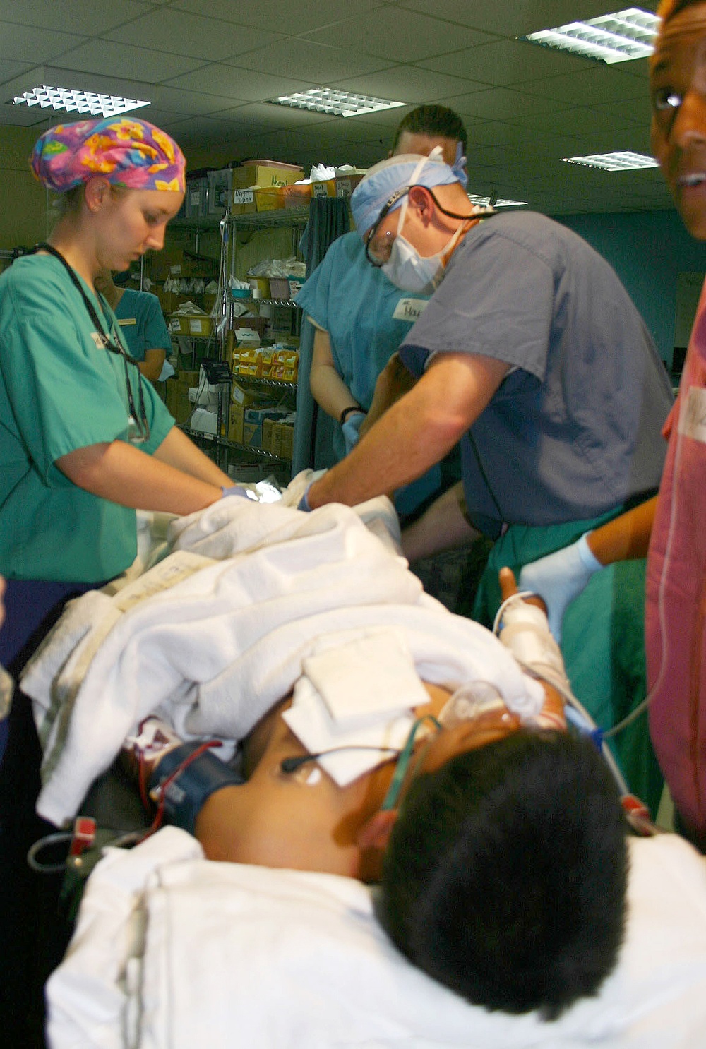 U.S. Military Doctors Treat Iraqi Teen Injured by IED