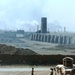 Humvees Guard Entrance to Bustling Brick Factory in Iraq