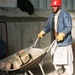Afghan Man Cleans Up After Skilled-Labor Workshop at Forward Operating Base