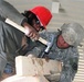 Army Spc. Guides Afghan Man During Skilled-Labor Workshop in Afghanistan