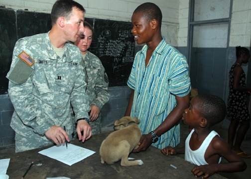 Veterinarian Inoculates Puppy Belonging to Liberian Man
