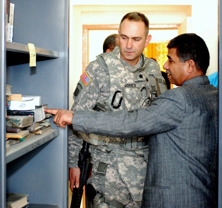 University Dean Shows Damage from Rocket Attack to U.S. Military Official