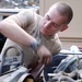Army Mechanic Repairs Radiator at Forward Operating Base in Afghanistan