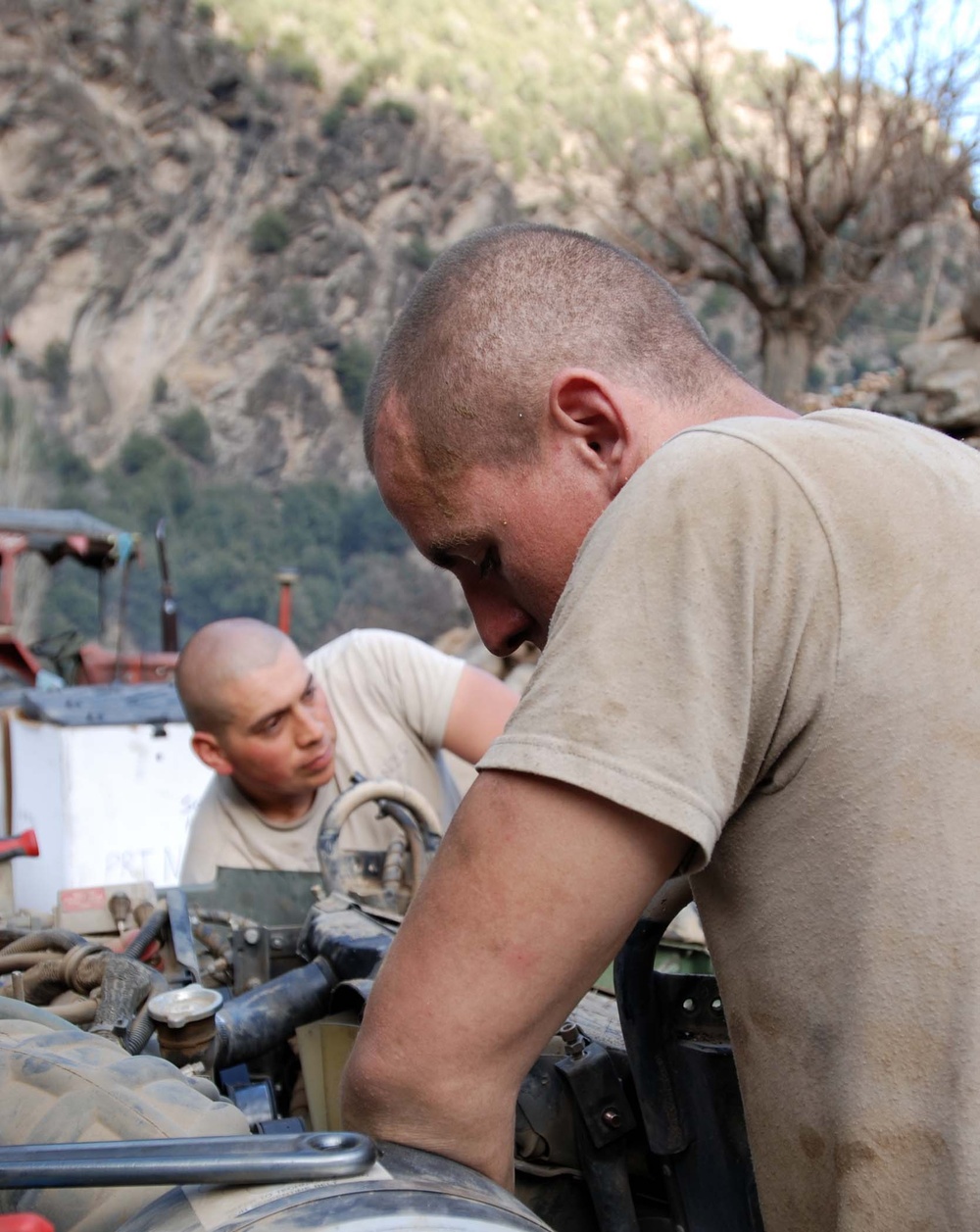 Army Mechanics Repair Damage from Rocket Attack in Afghanistan