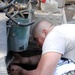 Army Mechanic Repairs Damaged Radiator at Forward Operating Base in Afghanistan