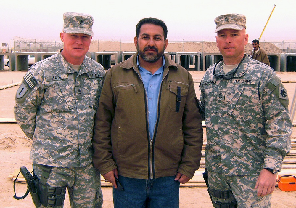 U.S. Soldiers and Iraqi Supervisor Oversee Construction at Camp Bucca