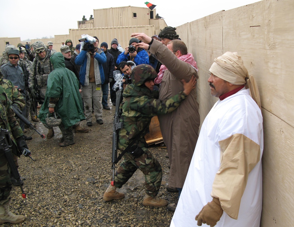 Afghan Soldier Conducts Search During U.S. Advisor Training