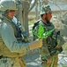 Marine Examines Poppy Plant with Afghan Soldier in Helmand Province
