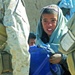 Afghan Boy Receives School Bag from U.S. and Afghan Forces