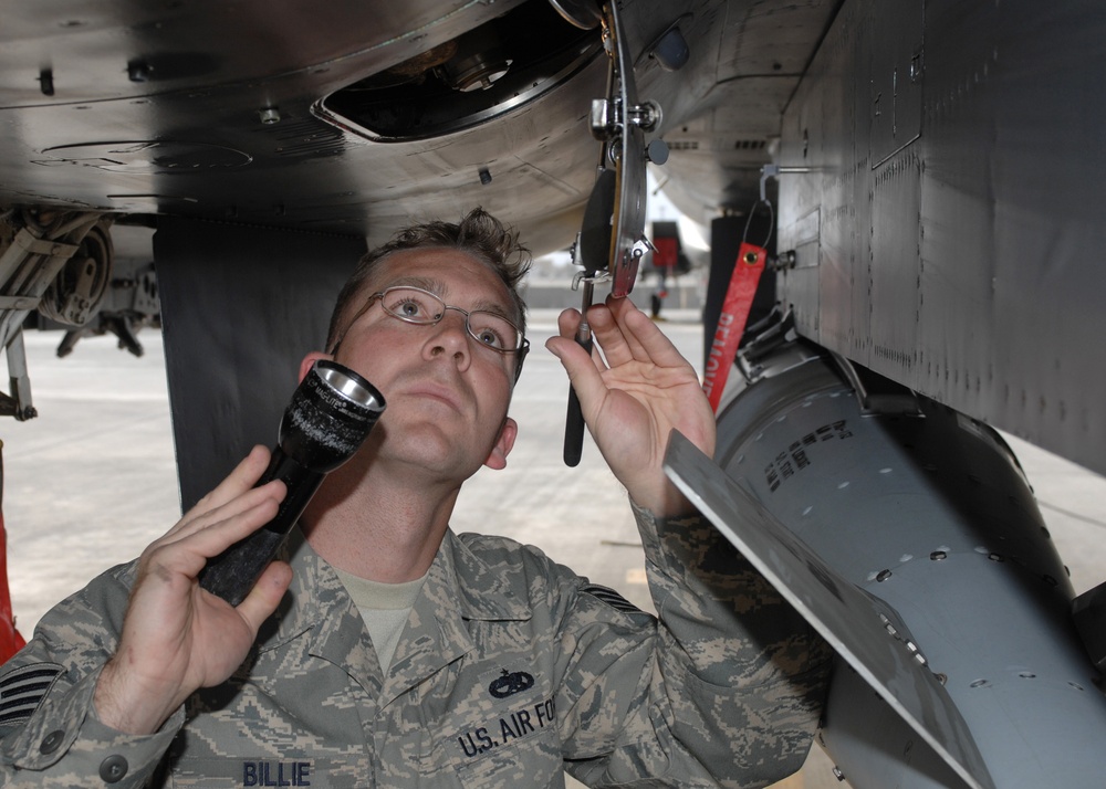 Air Force Crew Chief Inspects F-15E Strike Eagle at Bagram Air Base