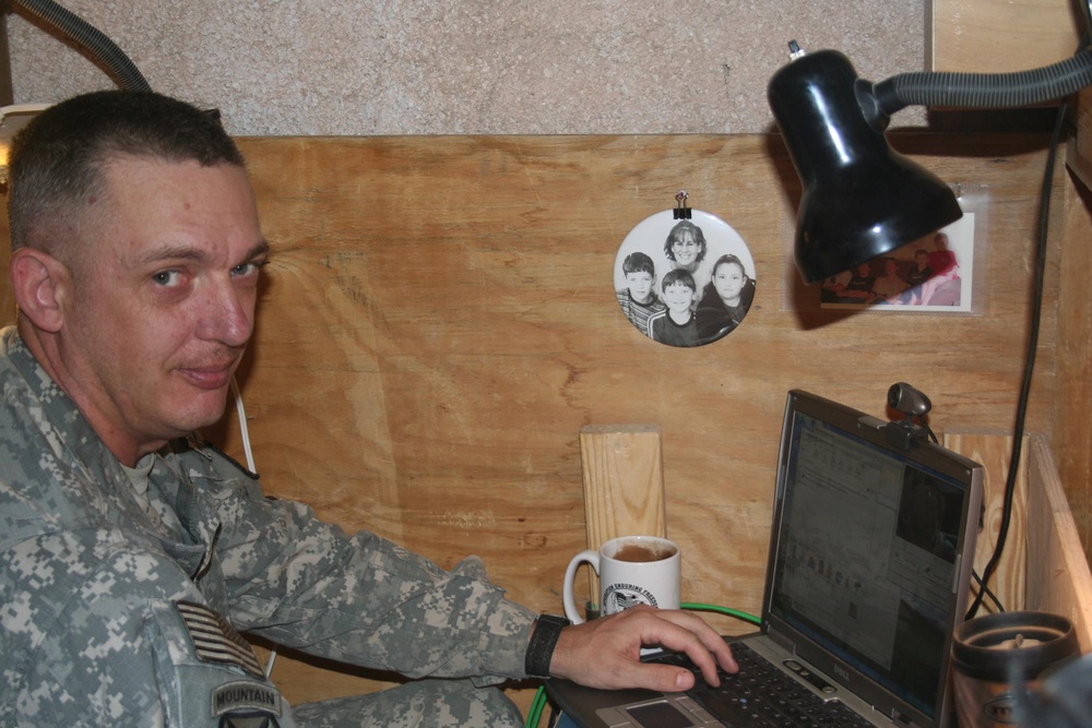 Soldier Connects with Family via Internet at Forward Operating Base in Afghanistan