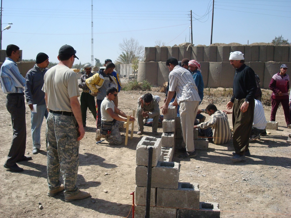 Air Force Master Sgt. Teaches Iraqi Block Makers Construction Techniques